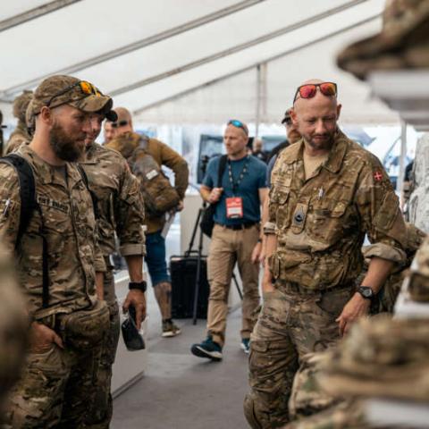 People in military uniforms at the exhibition