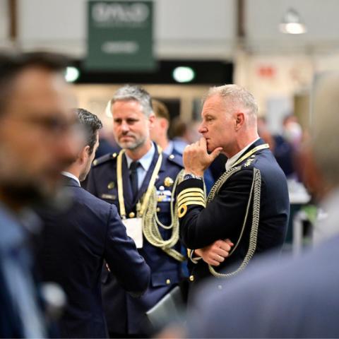 People in military uniforms at the exhibition