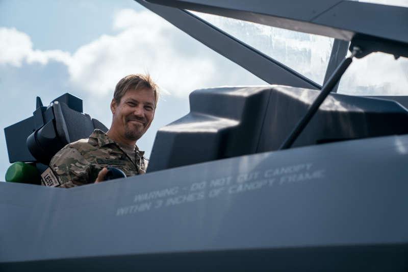 Military man in an open jet